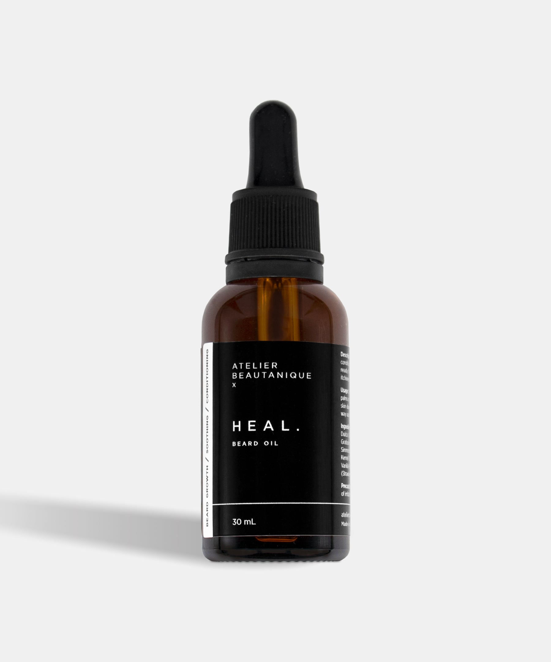 Atelier Beautanique HEAL. Beard Oil Bottle on Grey Background with Light Shadow