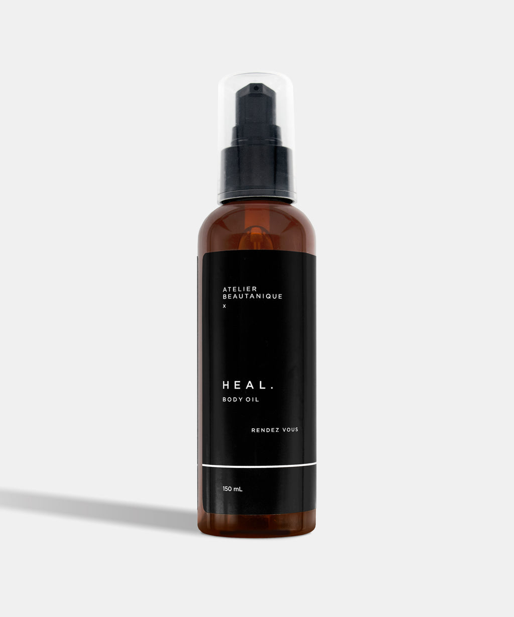 Atelier Beautanique HEAL. Rendez Vous Body Oil Bottle on Grey Background with Light Shadow
