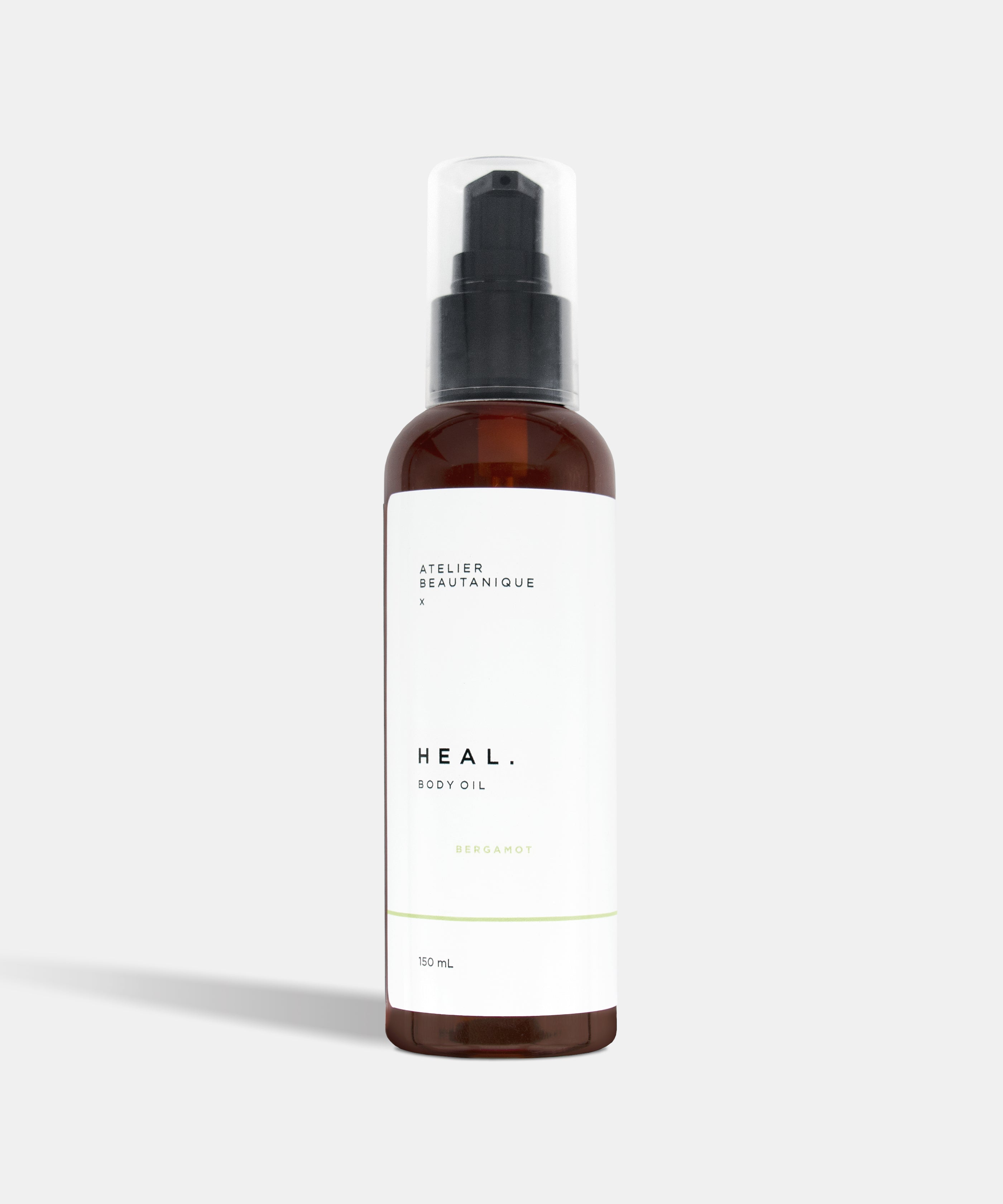 Atelier Beautanique HEAL. Bergamot Body Oil Bottle on Grey Background with Light Shadow