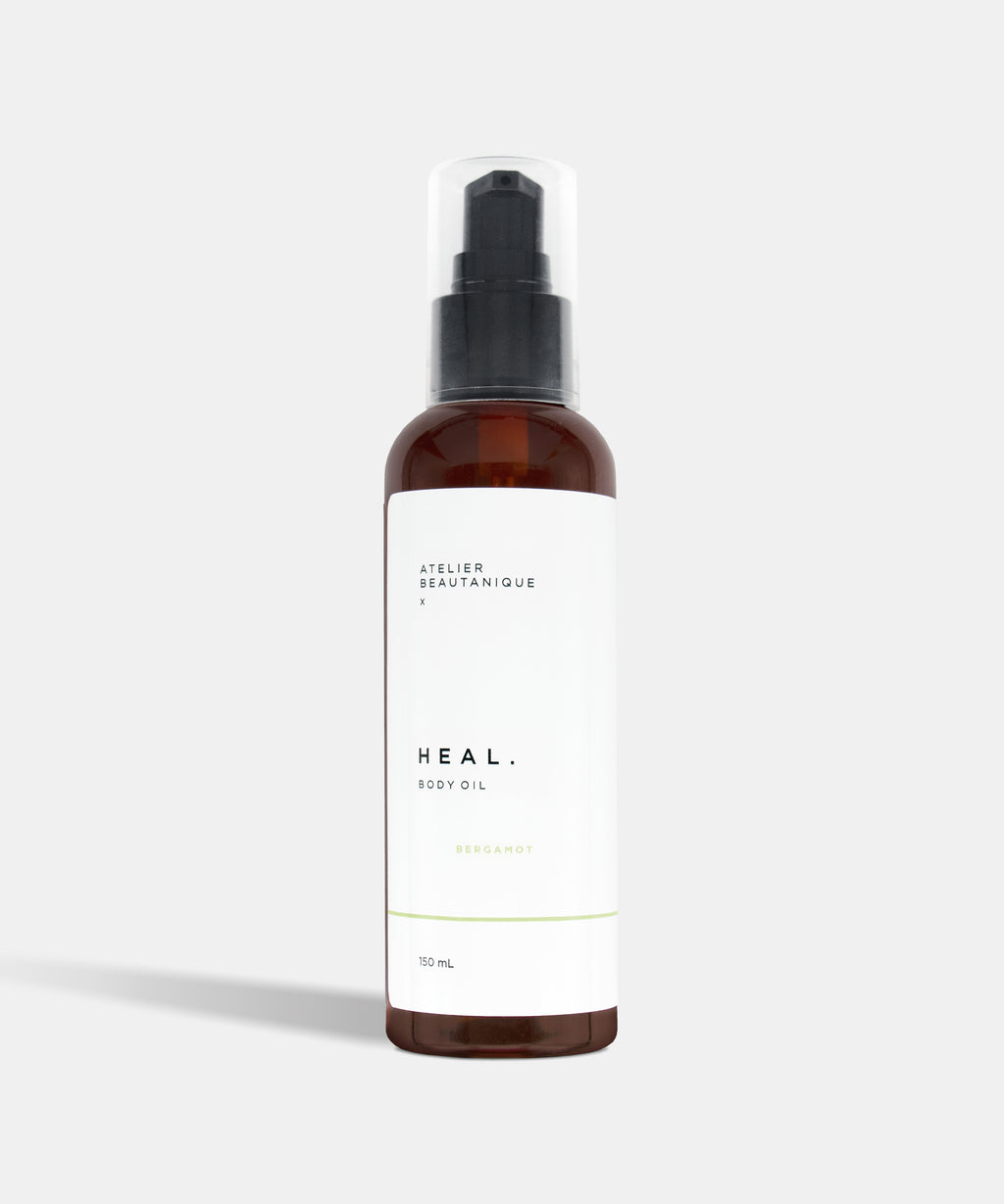 Atelier Beautanique HEAL. Bergamot Body Oil Bottle on Grey Background with Light Shadow