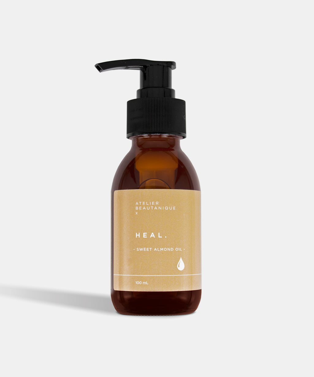 Atelier Beautanique HEAL. Sweet Almond Oil Bottle on Grey Background with Light Shadow