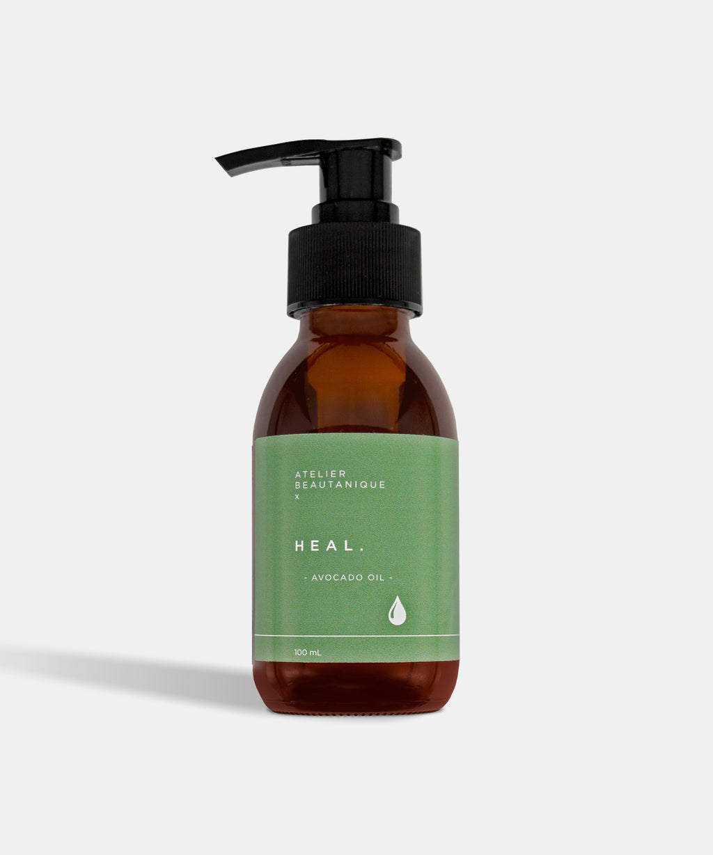 Atelier Beautanique HEAL. Avocado Oil Bottle on Grey Background with Light Shadow