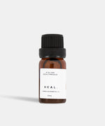 Load image into Gallery viewer, Atelier Beautanique HEAL. Cinnamon Essential Oil 10mL Bottle on Grey Background with Light Shadow
