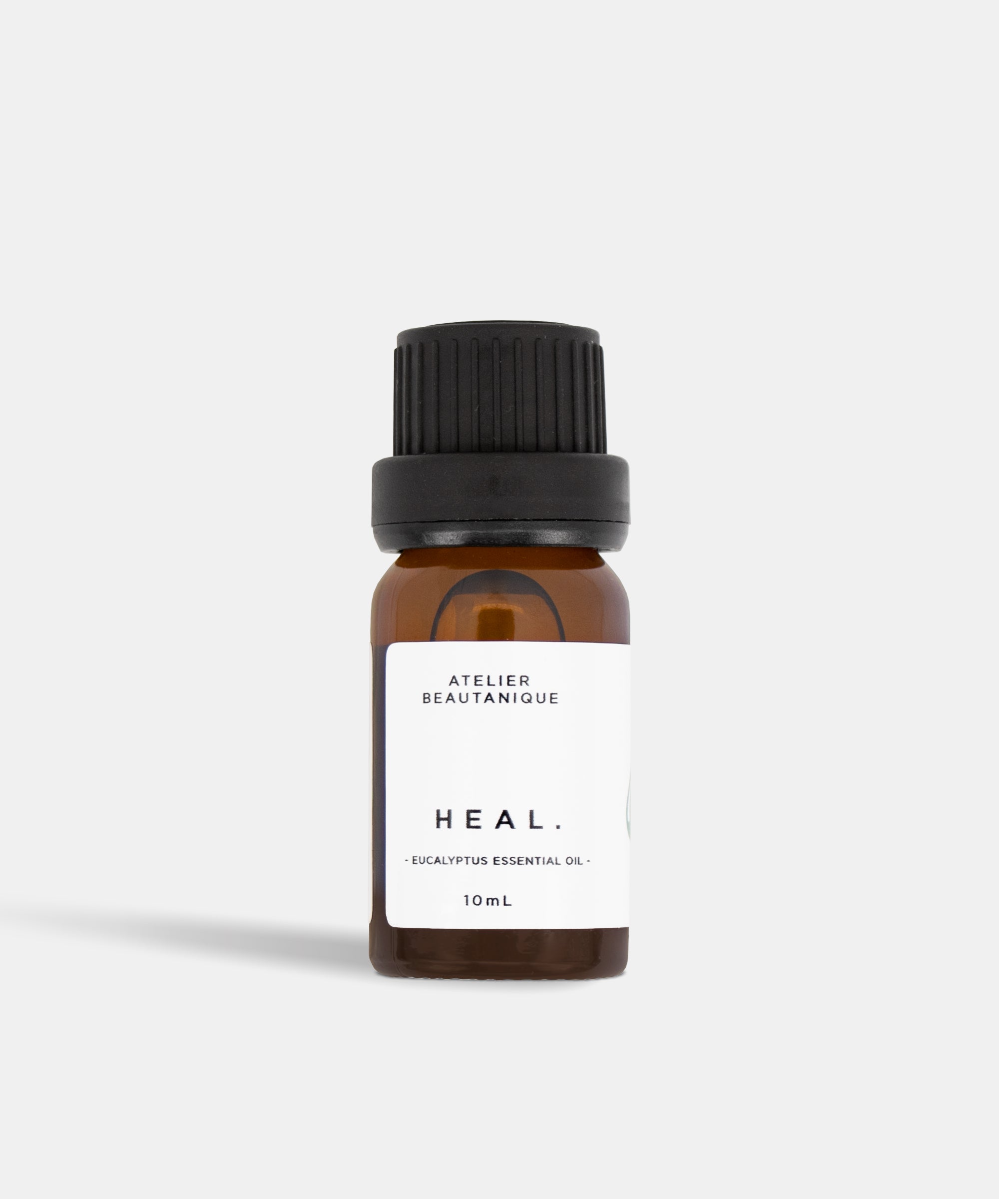 Atelier Beautanique HEAL. Eucalyptus Essential Oil 10mL Bottle on Grey Background with Light Shadow