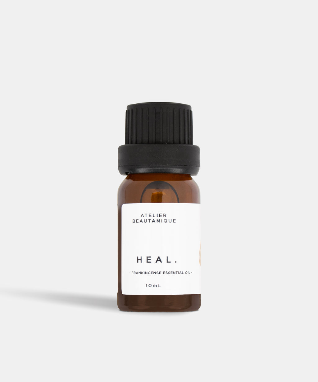 Atelier Beautanique HEAL. Frankincense Essential Oil Bottle on Grey Background with Light Shadow