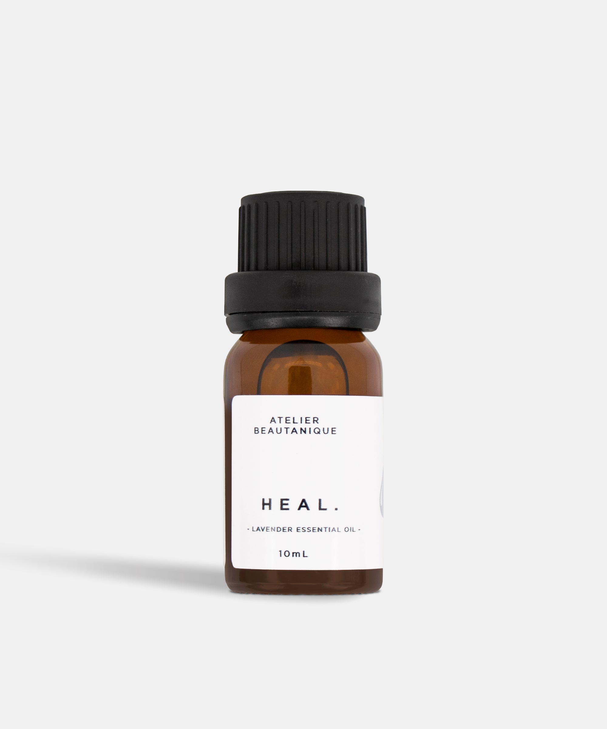 Atelier Beautanique HEAL. Lavender Essential Oil 10mL Bottle on Grey Background with Light Shadow