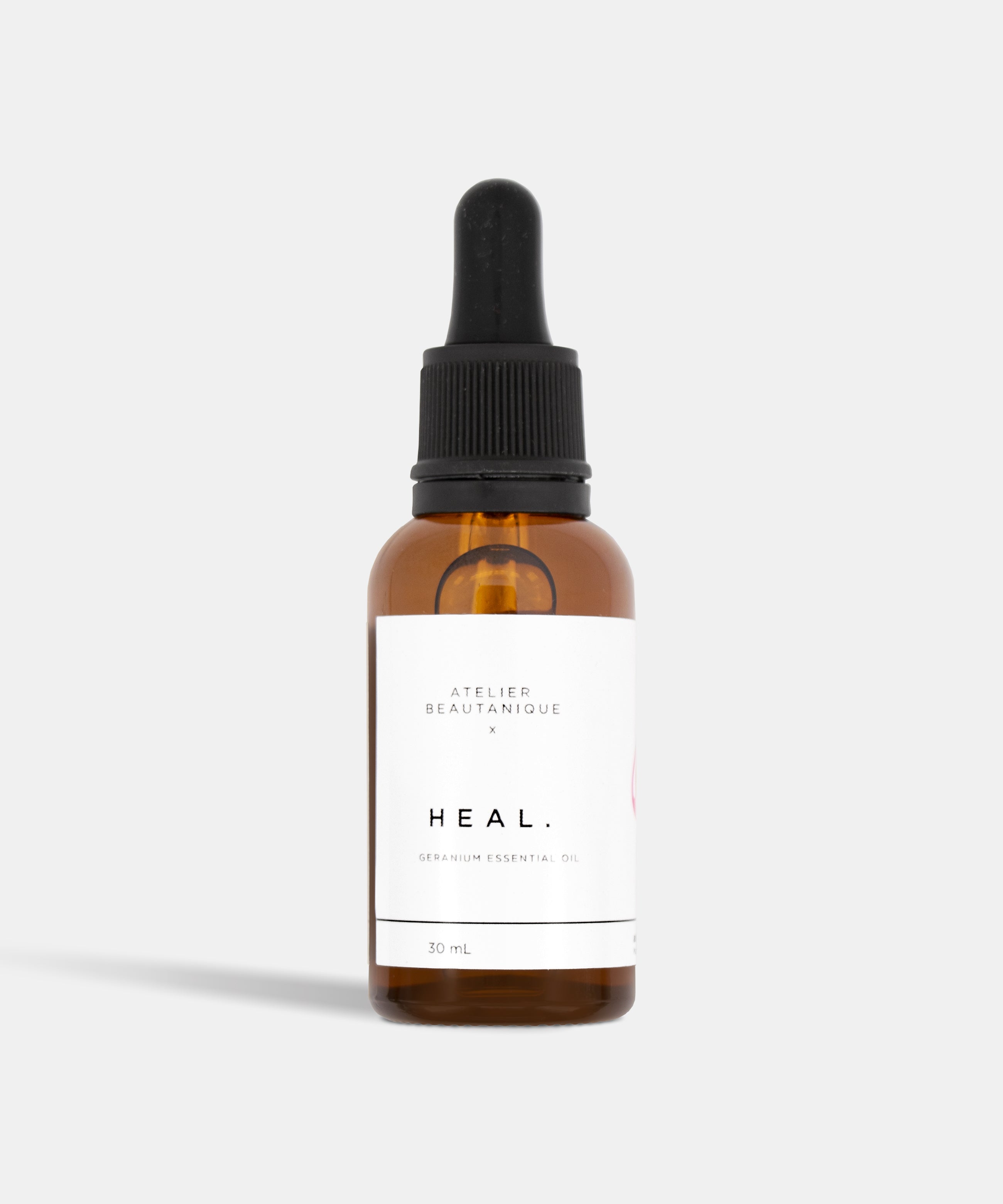 Atelier Beautanique HEAL. Geranium Essential 30mL Oil Bottle on Grey Background with Light Shadow