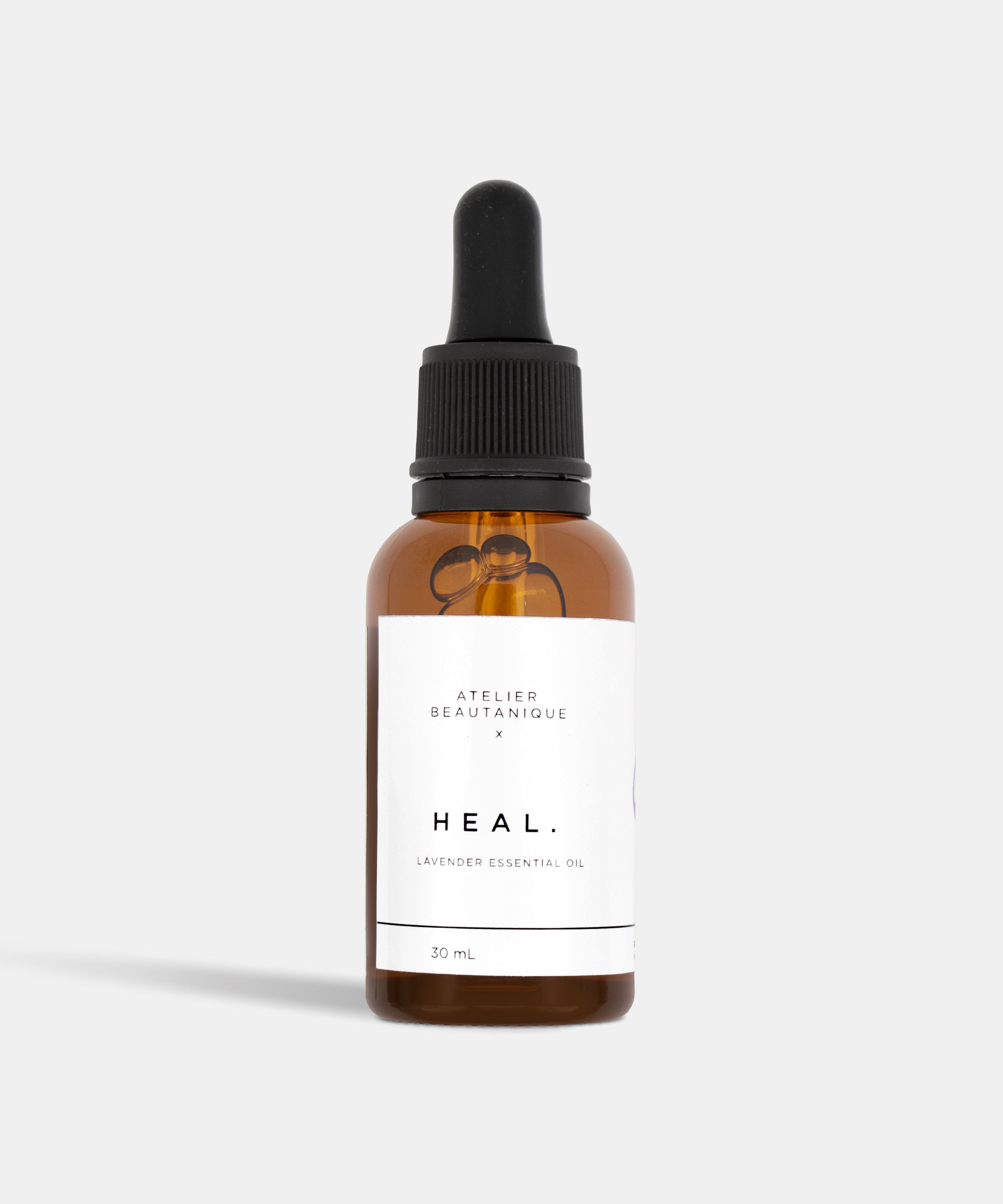 Atelier Beautanique HEAL. Lavender Essential Oil 10mL Bottle on Grey Background with Light Shadow