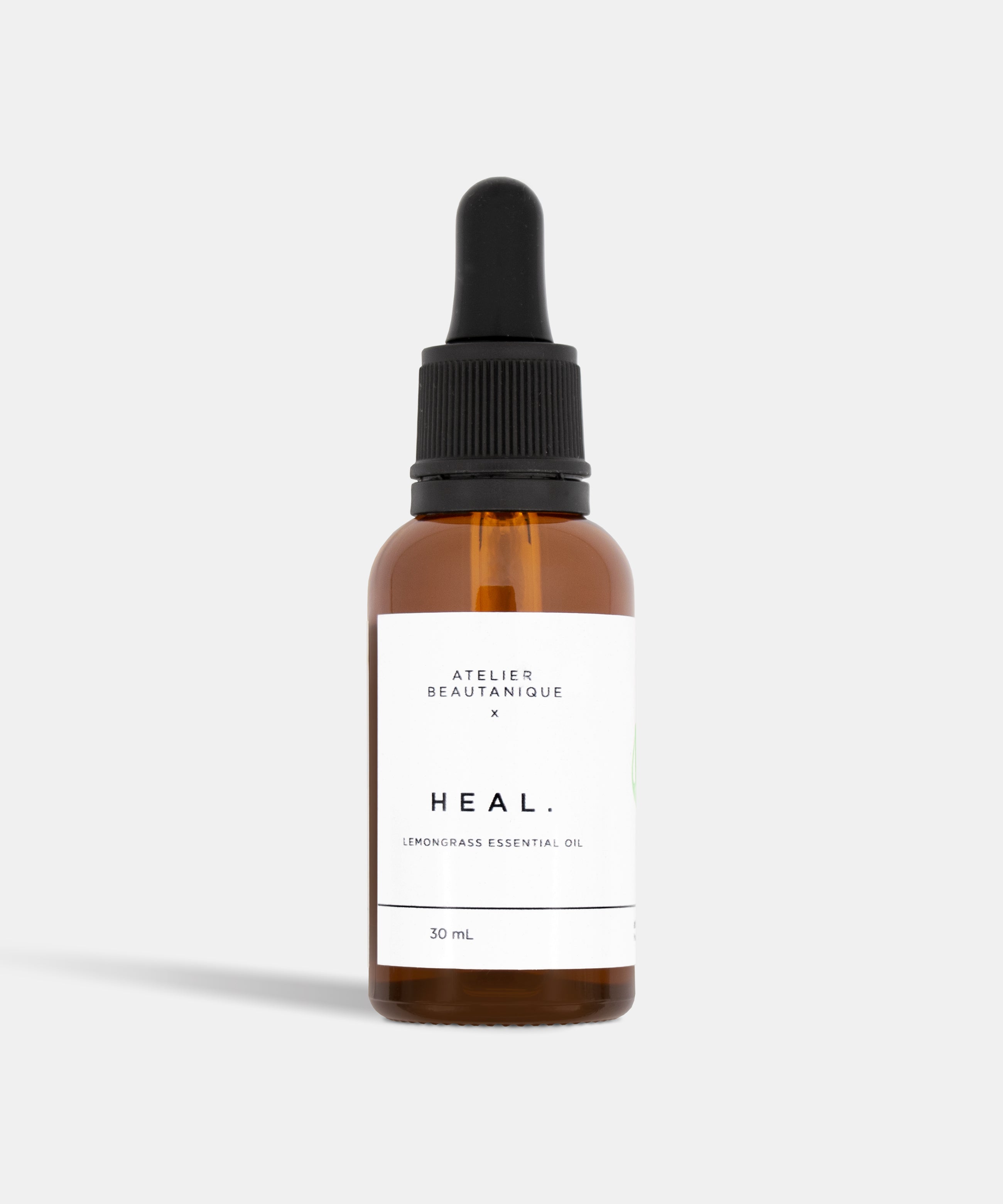 Atelier Beautanique HEAL. Lemongrass Essential Oil 10mL Bottle on Grey Background with Light Shadow