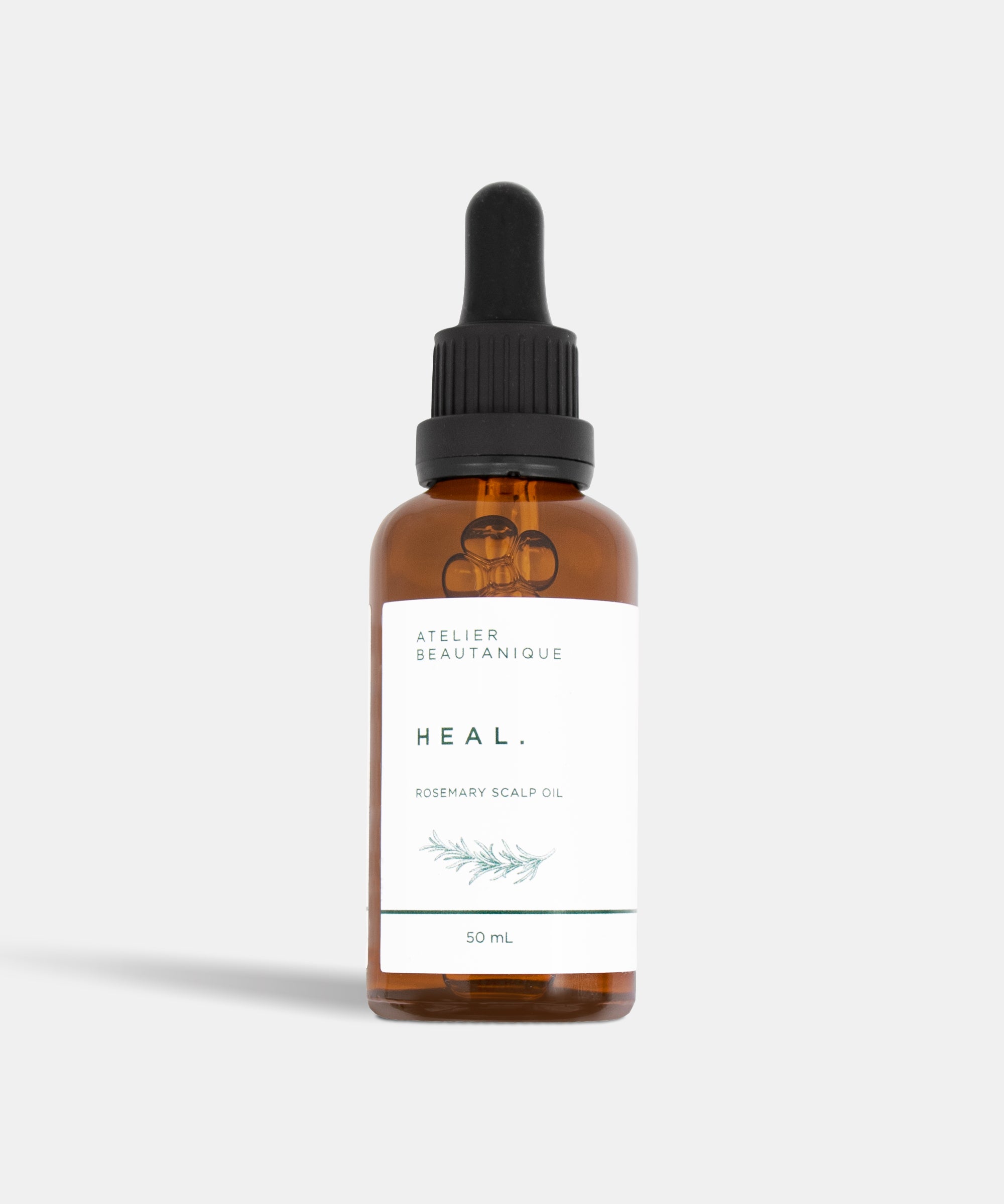 Atelier Beautanique HEAL. Rosemary Scalp Oil Bottle on Grey Background with Light Shadow