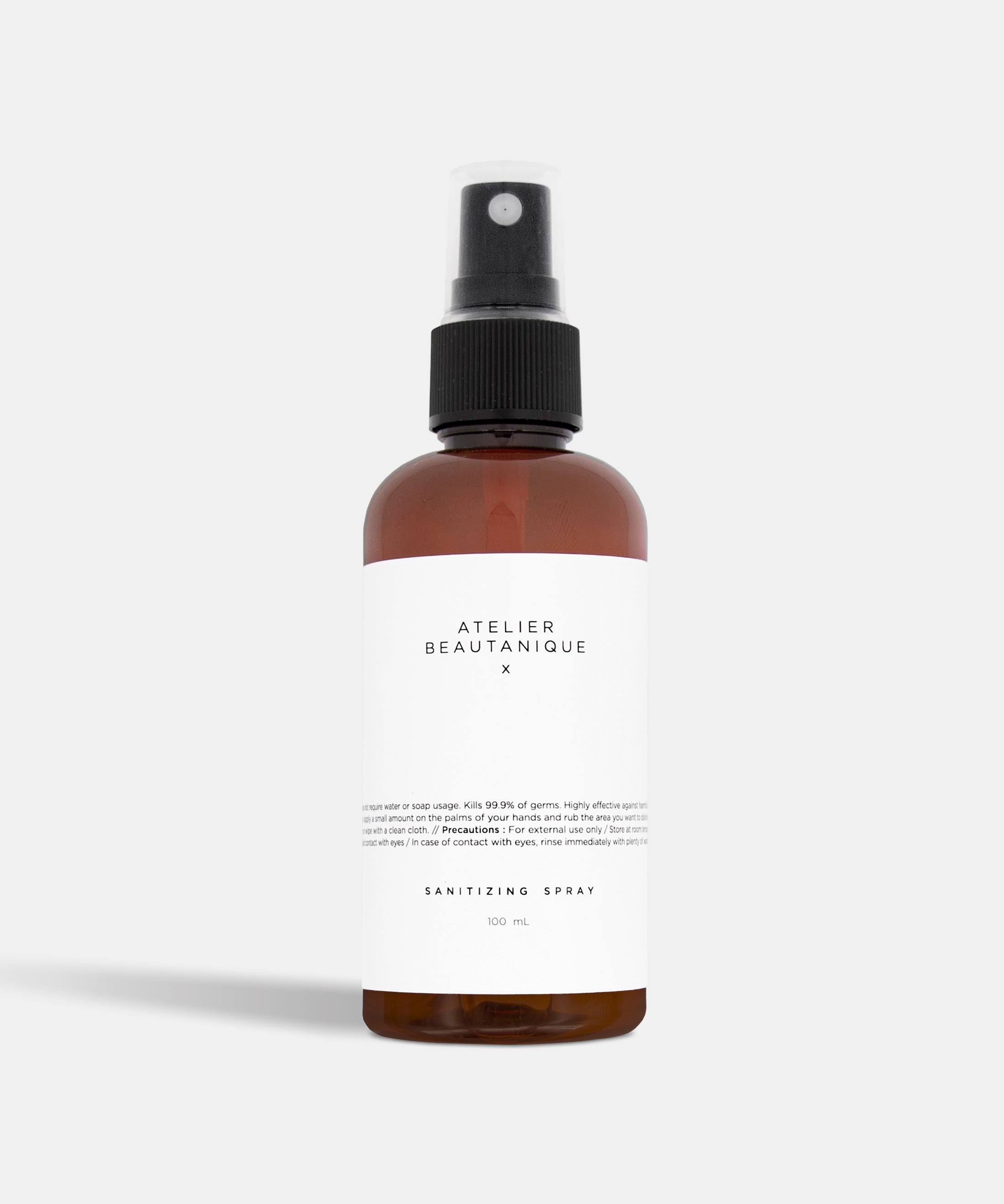 Atelier Beautanique Sanitizing Spray Bottle on Grey Background with Light Shadow