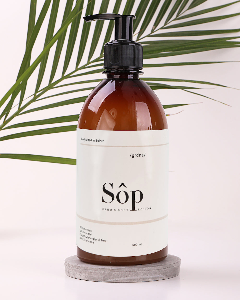 Atelier Beautanique Sôp Gardenia Body Lotion 500mL Bottle on Gray Background with Light Shadow